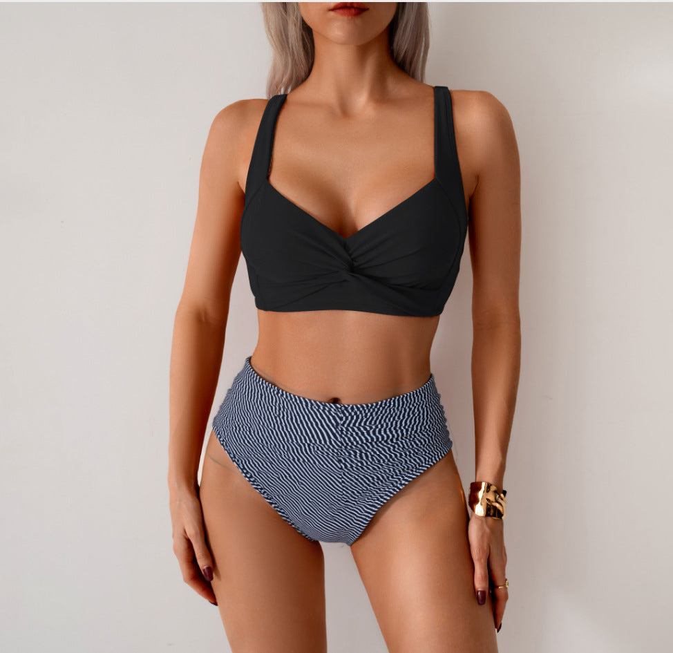 Two-piece bikini set with black twist triangle top and dark striped high-waist ruched bottoms