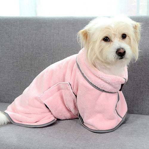 Pink microfiber pet bathrobe with hood, dog lying on a couch