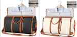 Duffle bags on hangers: black and cream with brown strap trim and tassel zipper pulls
