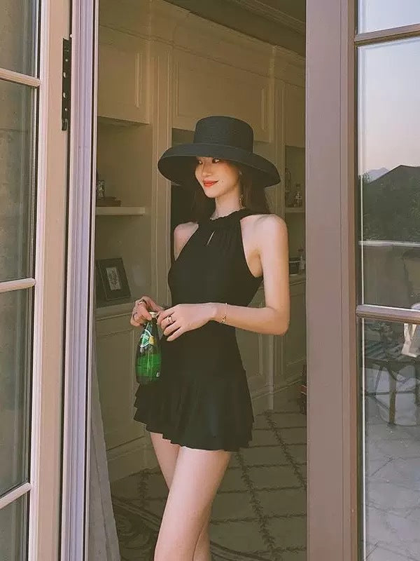 Front-facing one-piece swimsuit, high neck sleeveless top with flared skirt peplum, dark