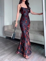 Black floral sleeveless maxi dress with thin spaghetti straps and fitted mermaid hem