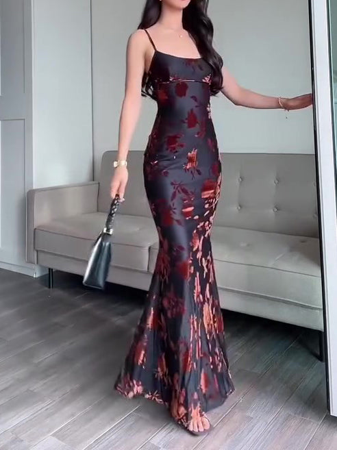 Black floral sleeveless maxi dress with thin spaghetti straps and fitted mermaid hem