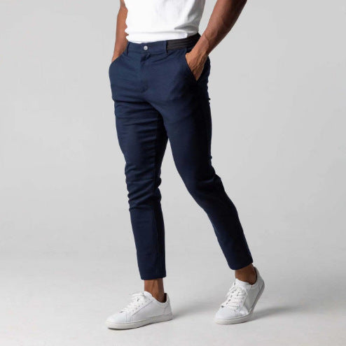 Men's slim-fit business suit pants in navy, straight leg with front crease