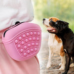 Pink silicone dog treat pouch waist pack with circular popper texture front