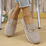 Khaki women’s canvas flat sneakers with gold horsebit-style detail, slip-on design.