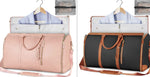 Two foldable waterproof duffle bags, pale pink and black with brown trim and handles