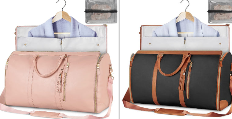 Two foldable waterproof duffle bags, pale pink and black with brown trim and handles