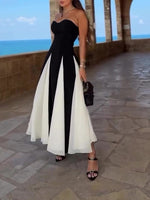 Black tube-top maxi dress with vertical black-and-white paneling at the skirt