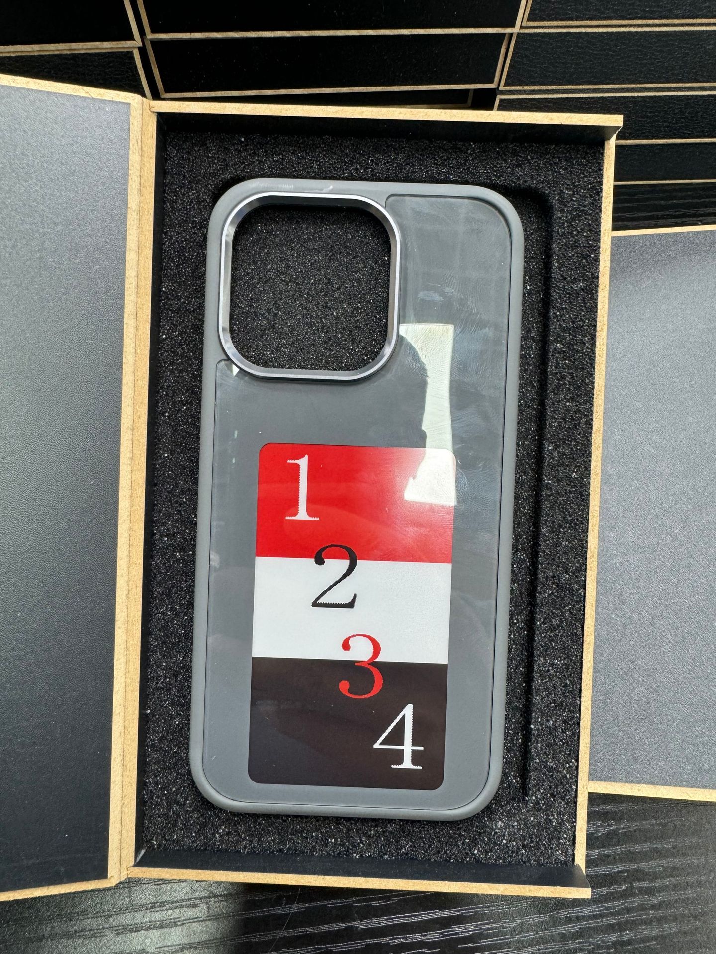 Gray NFC smart display phone case with numbered screen graphic in display window