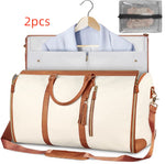White waterproof duffel bag with brown handles, open interior organizer, shoulder strap