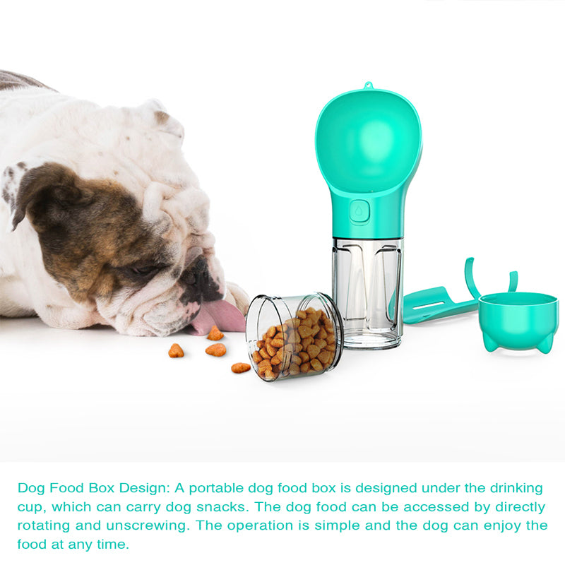 Teal portable pet water bottle feeder with clear snack chamber beside a sleeping dog
