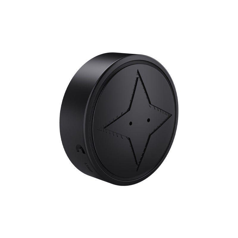 Black mini GPS tracker with strong magnet, angled view of round face and back