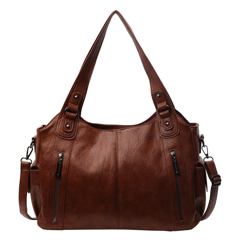 Brown PU hobo handbag with double straps and two front vertical zip pockets