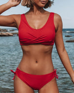Red bikini swimsuit with crossover V-neck top and side-tie ruched high-waist bottoms