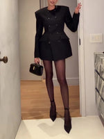 Black double-breasted mini blazer dress with tailored waist, button front, and short skirt hem