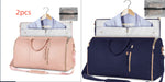 Pink and navy waterproof duffel bag set with open interior, shirt-hanger pocket