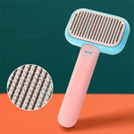 Pet grooming brush with stainless pins, light blue head and pink handle