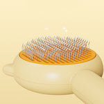 Yellow pet grooming brush head with long pins for removing loose fur