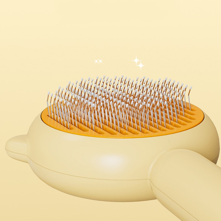 Yellow pet grooming brush head with long pins for removing loose fur
