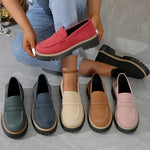 Women’s flat loafer shoes in multiple colors lined up, round toe and thick tread sole