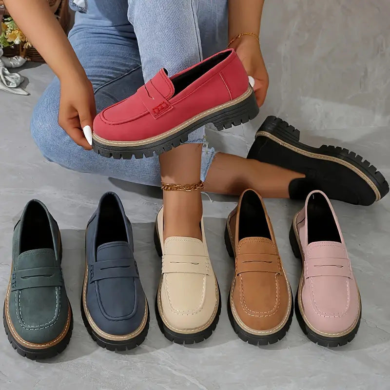 Women’s flat loafer shoes in multiple colors lined up, round toe and thick tread sole