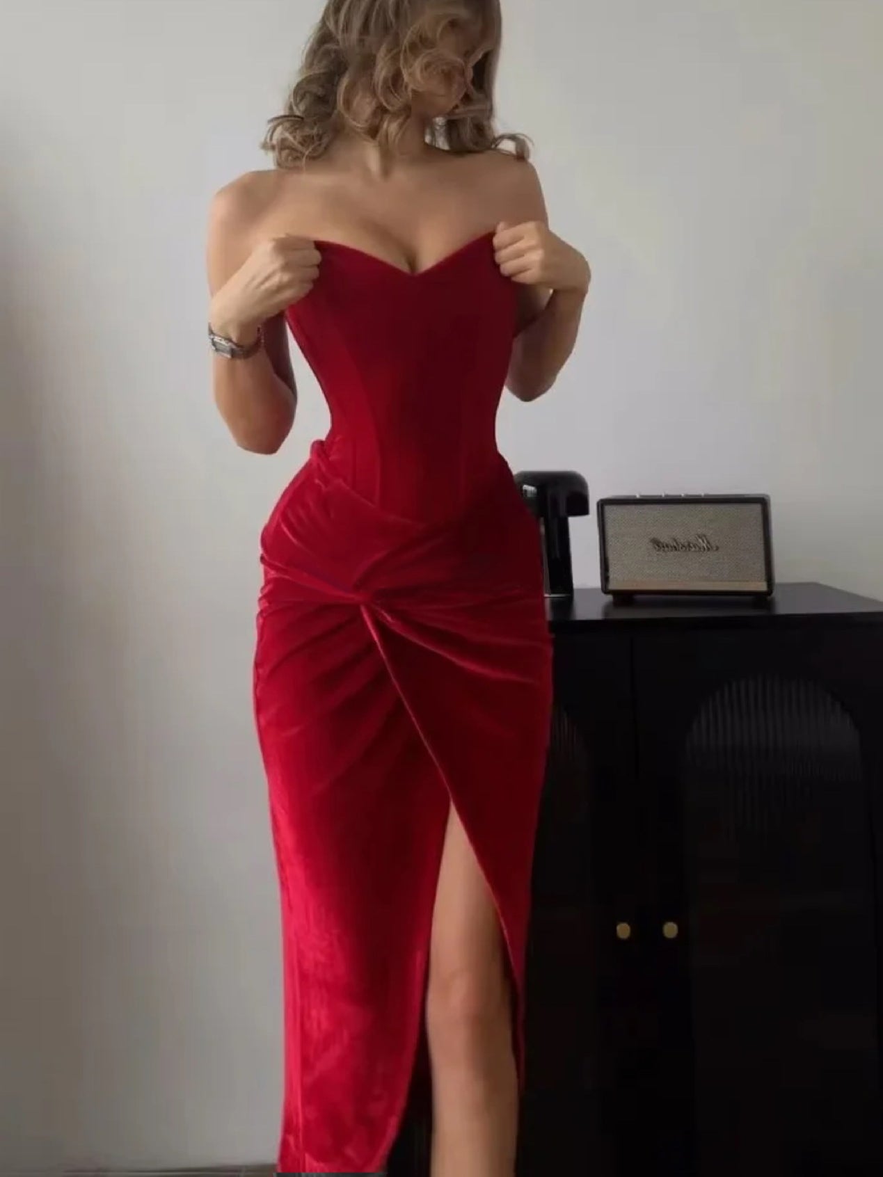 Red tube-top midi dress with twist detail, fitted silhouette, thigh-high front slit