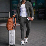 Men's zip-up long sleeve jacket and drawstring sweatpants set in dark gray, tapered legs