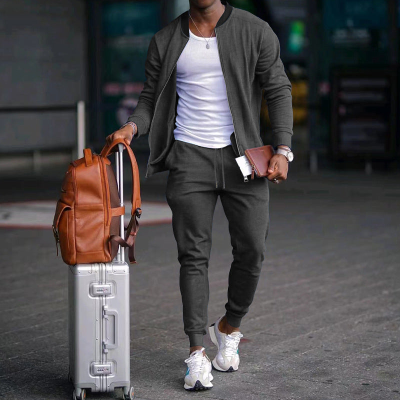 Men's zip-up long sleeve jacket and drawstring sweatpants set in dark gray, tapered legs