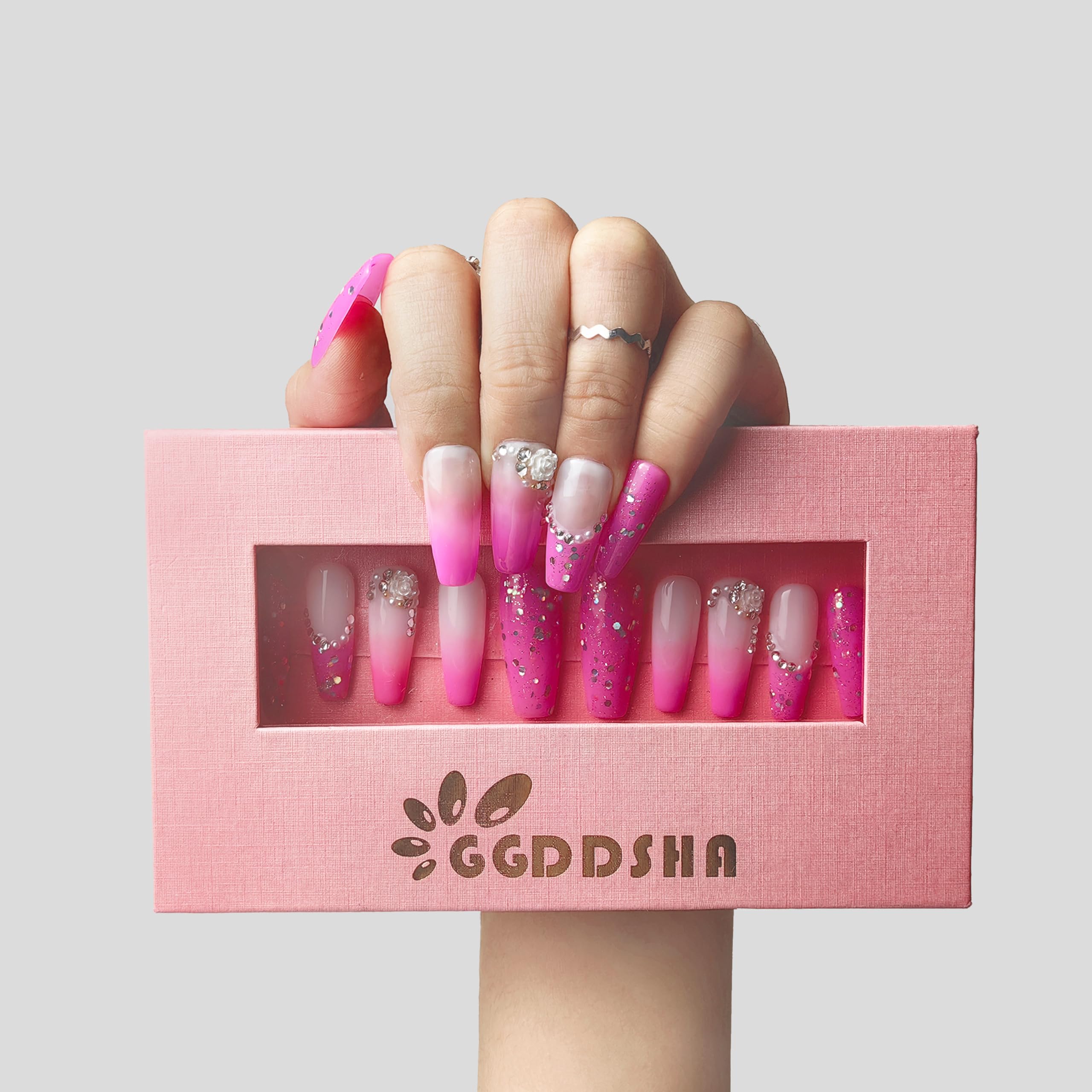 Press-on acrylic nail kit with pink gradient short false nails and rhinestone accents in box