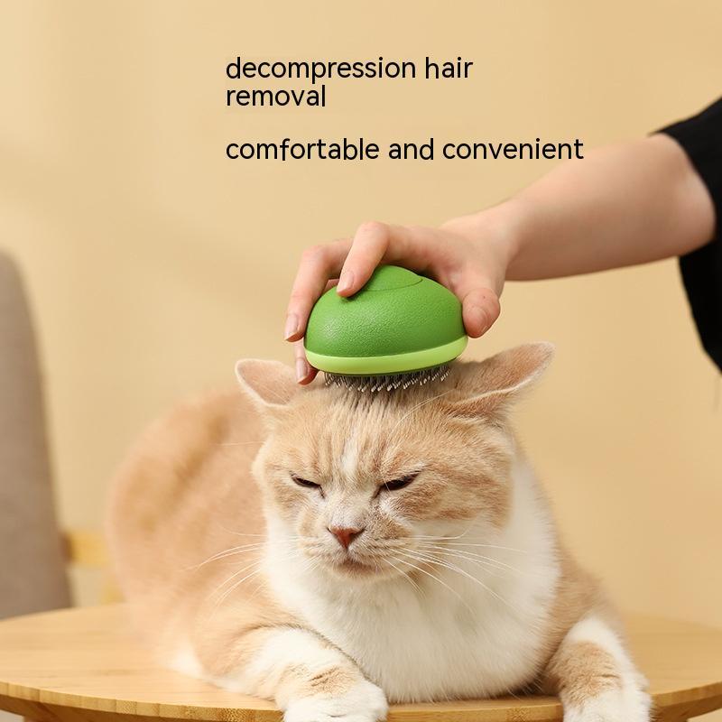 Green pet grooming comb with metal bristles, brushed across a cat coat