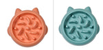 Orange and teal slow feeder pet bowls with raised anti-gulp ridge pattern