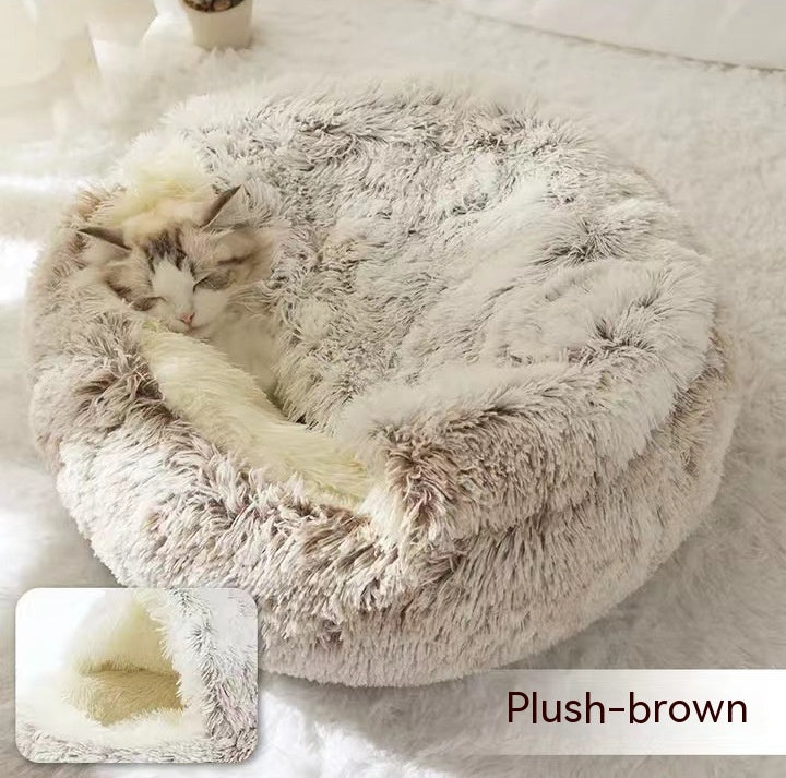 Round plush pet bed in brown plush, cat curled inside the circular bed