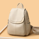 Women's PU leather travel backpack with front flap and side zippers, cream