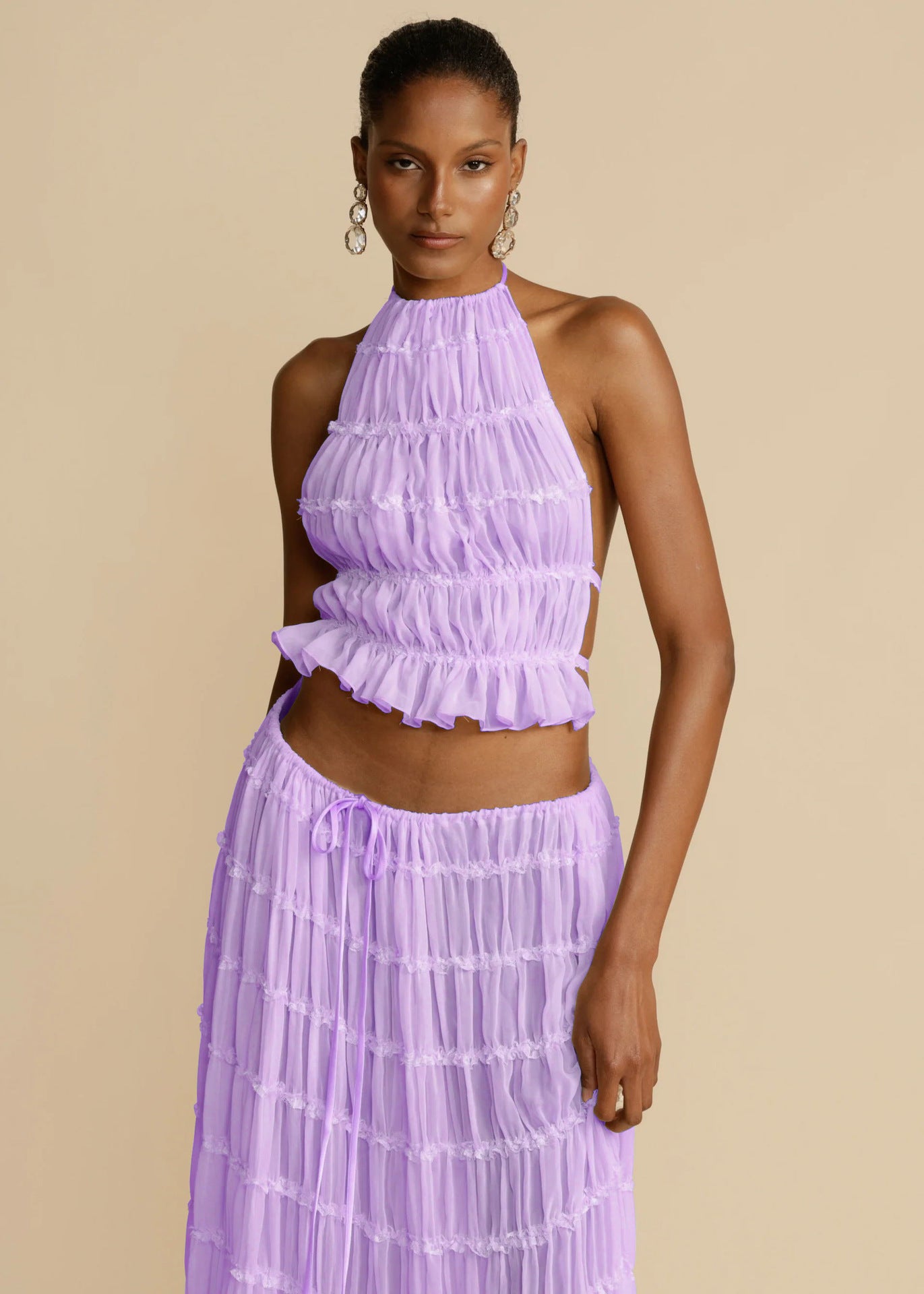 Purple halter crop top and pleated long skirt set with tiered ruffles and elastic waist