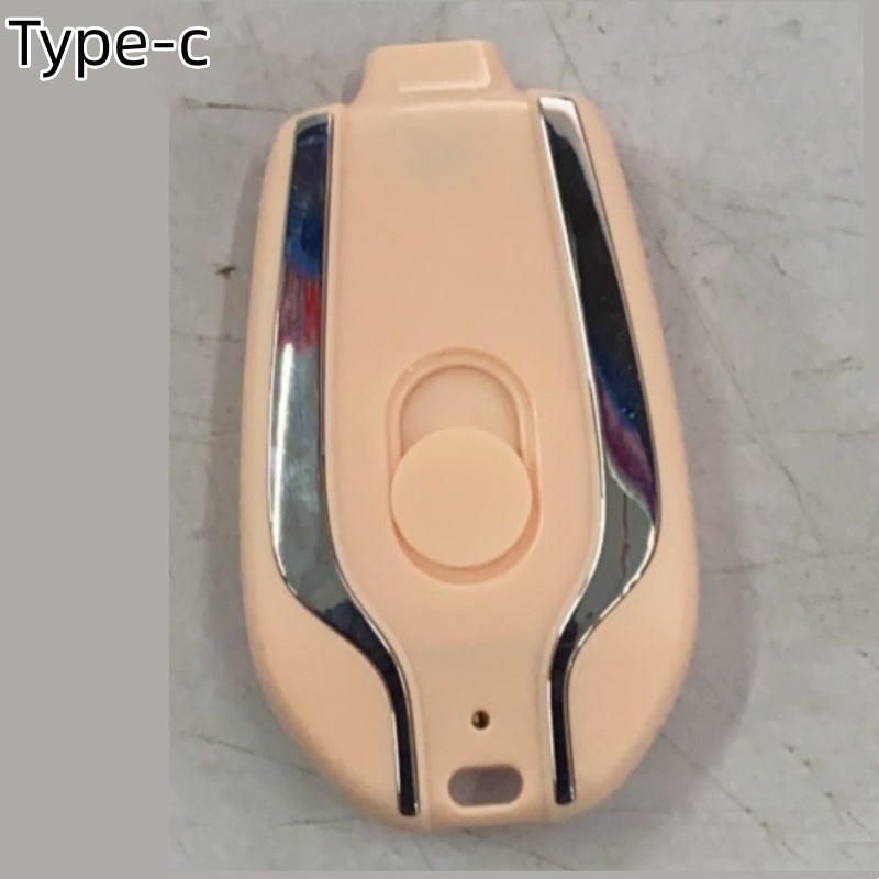 Beige keychain power pod charger with USB-C port, round button and small status slot