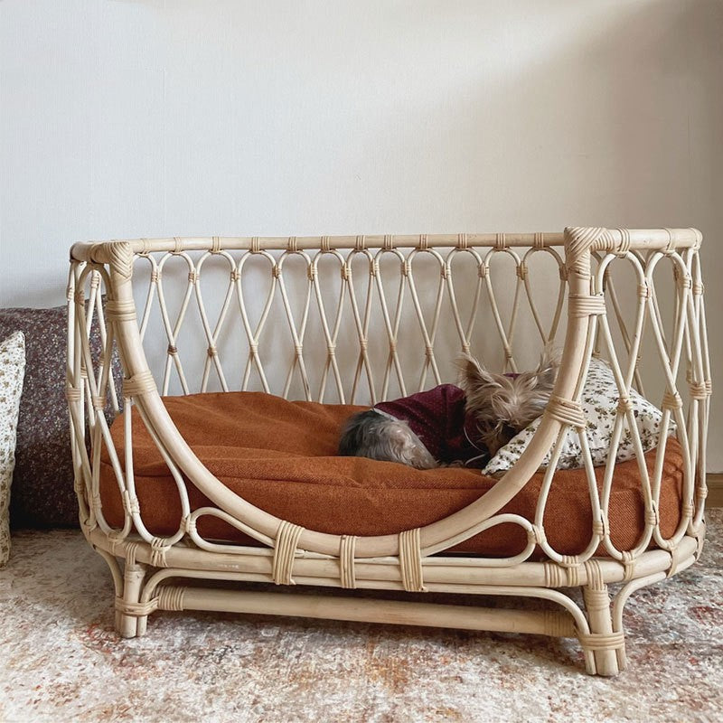 Handmade rattan pet bed with brown cushion and white woven frame, dogsize sofa style