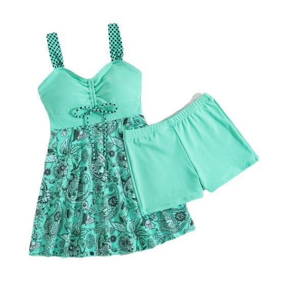 Turquoise bikini set with polka-dot straps and patterned skirt overlay with ruffle trim