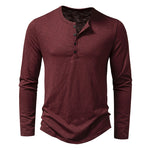Men's long sleeve henley pullover in wine red with button placket and curved hemline