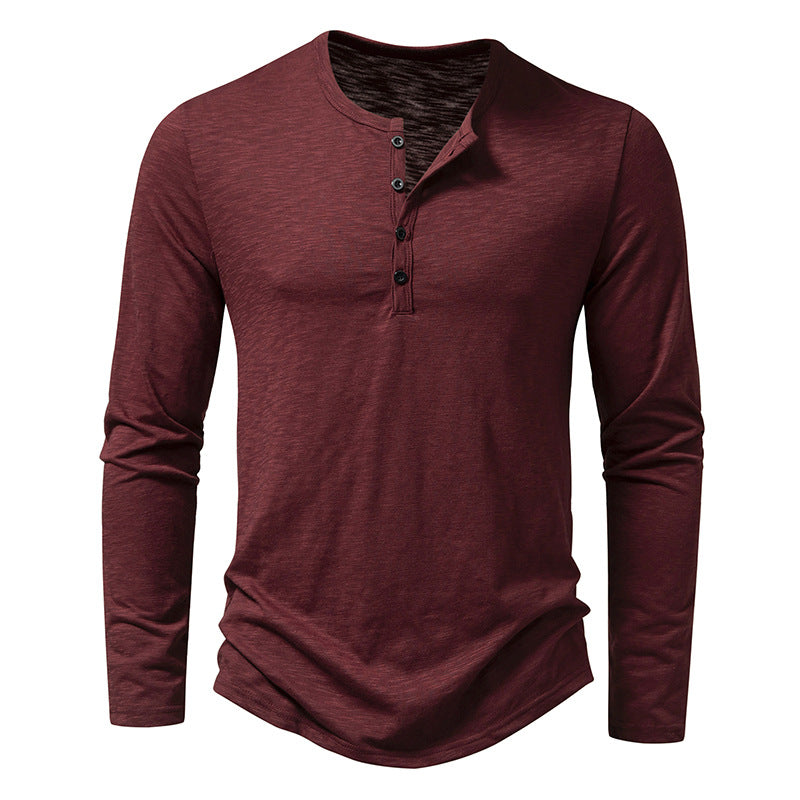 Men's long sleeve henley pullover in wine red with button placket and curved hemline