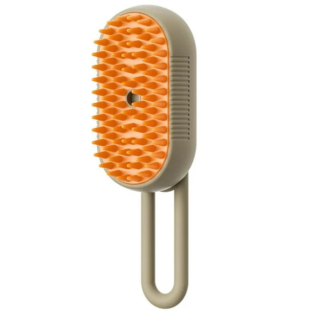 Electric steam pet brush with orange silicone bristles and beige handle