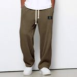 Waffle loose drawstring trousers in dark brown/olive with straight, roomy drape