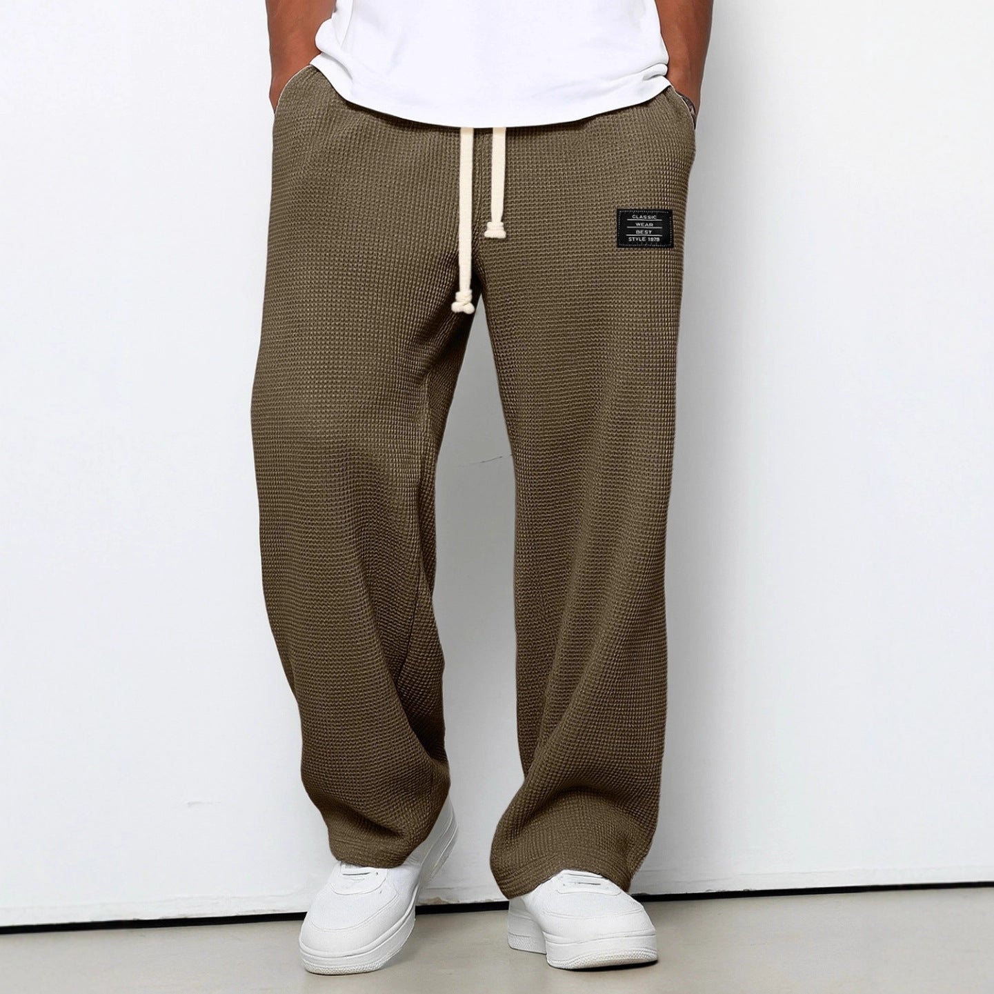 Waffle loose drawstring trousers in dark brown/olive with straight, roomy drape