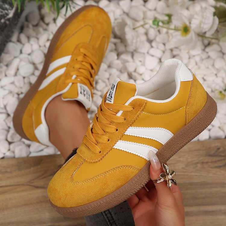 Women's casual sneakers in mustard yellow with white stripes, lace-up, gum sole