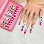 Stiletto press-on nail set in pink tray with zebra, leopard, and rhinestone details