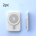 White magnetic wireless power bank with lightning logo and side profile view.