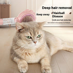 Pet grooming spray comb with pink flower head brushing a cat coat