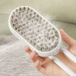 Electric steam pet brush with hair buildup on white bristle head