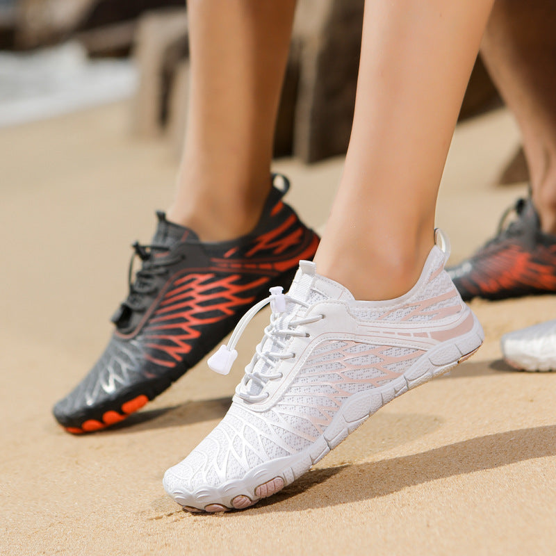 White water shoes with lace-up front and textured mesh upper on a foot.