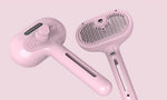 Pink pet grooming brush set with mist comb head and handle, two-piece view