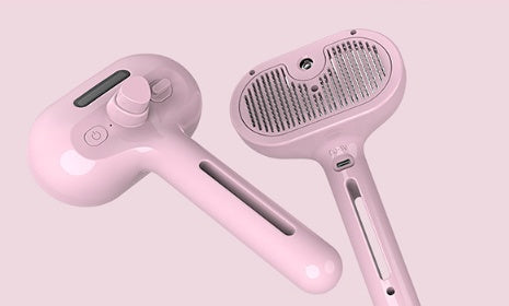 Pink pet grooming brush set with mist comb head and handle, two-piece view
